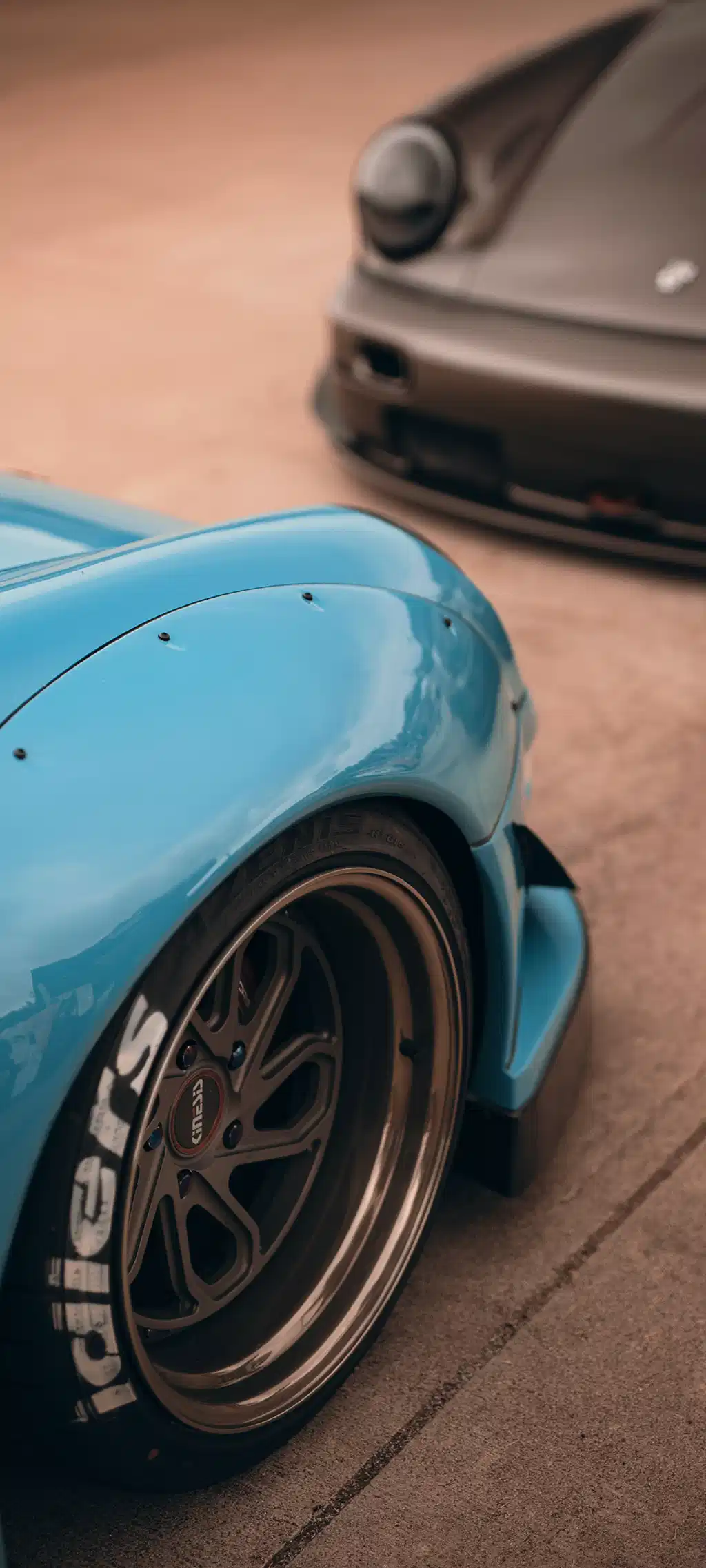 Cyan Blue Sports Car Wheel Close Up