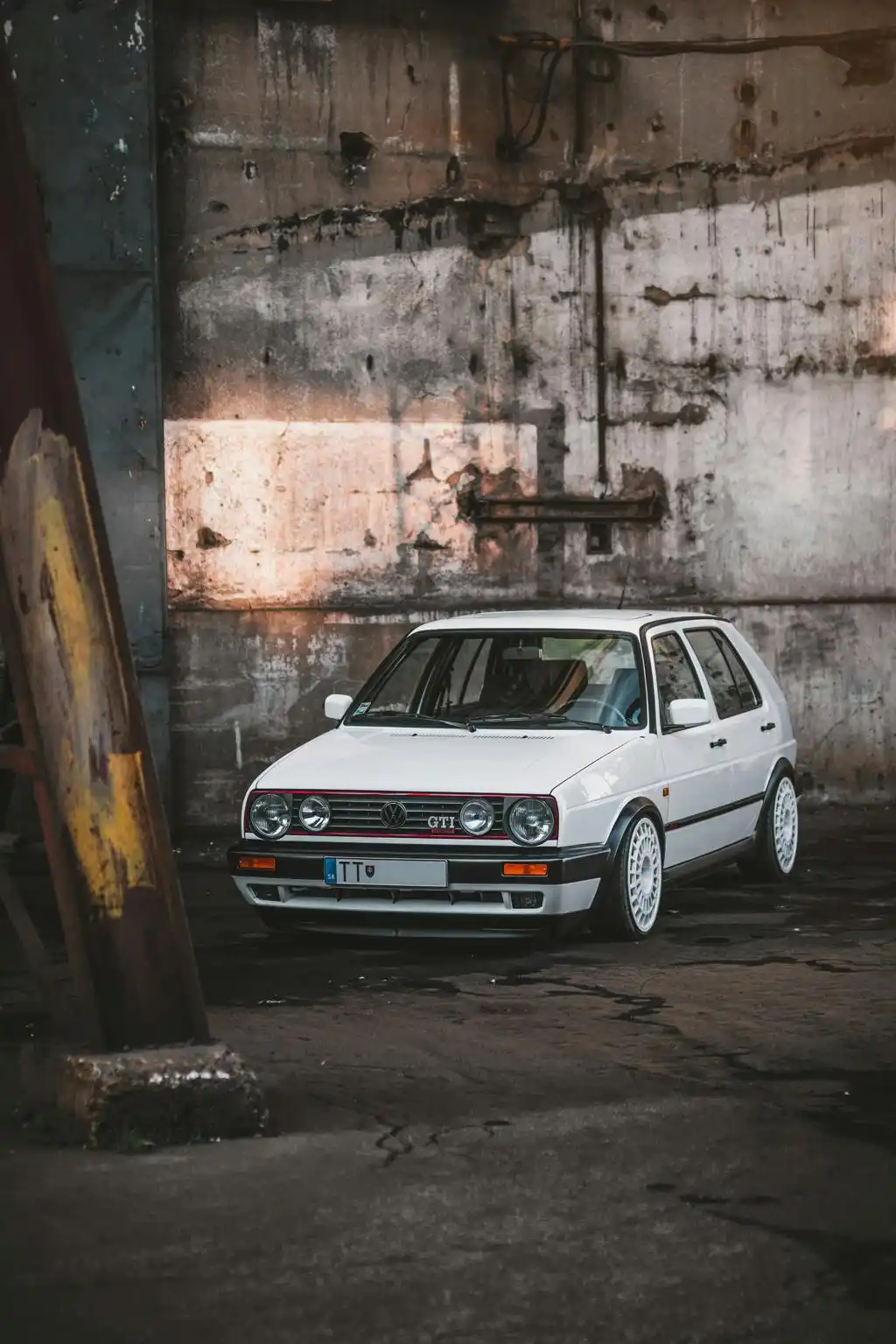 Classic White Sedan Brick Wall