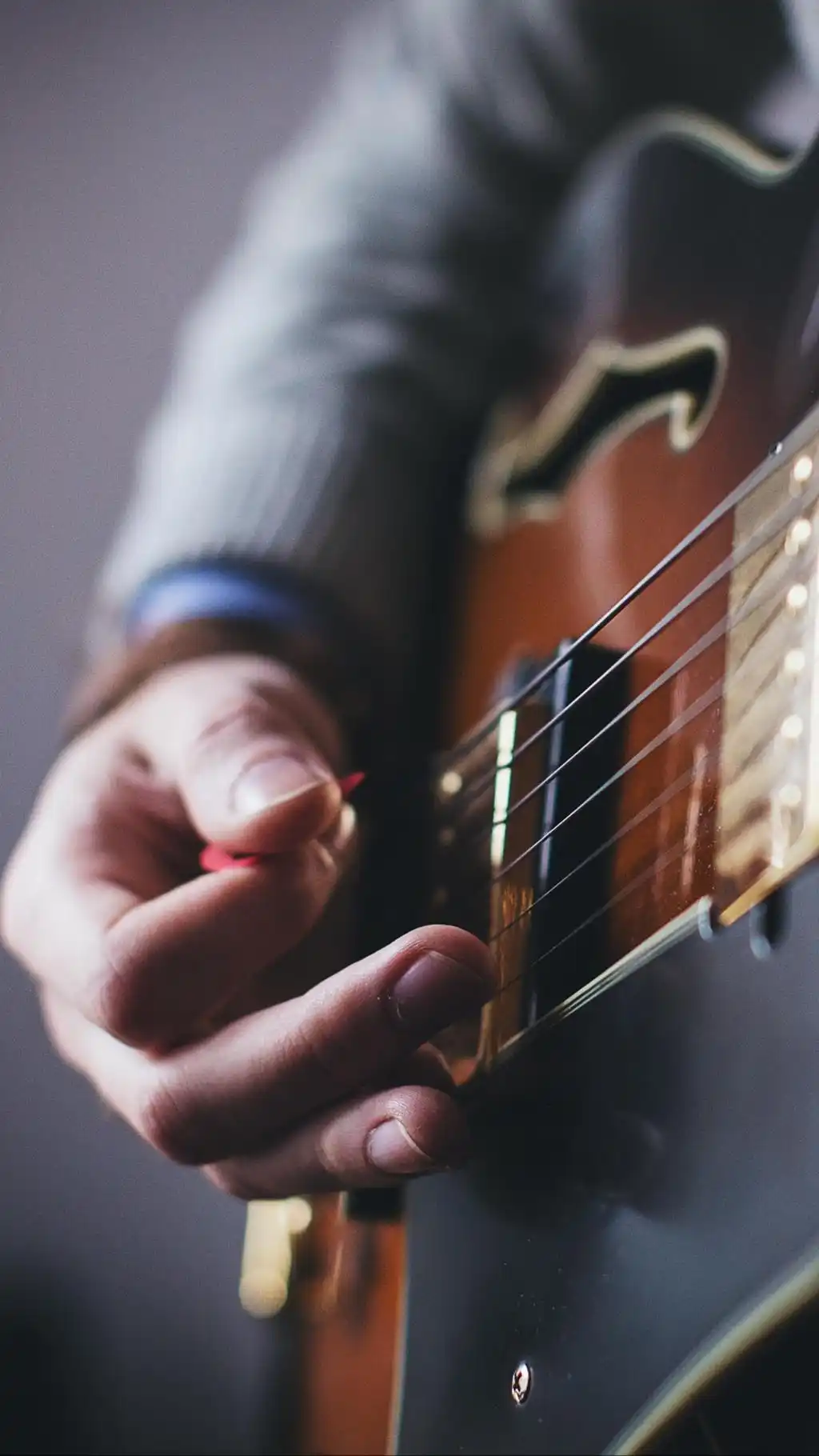 Playing Acoustic Guitar Close Up